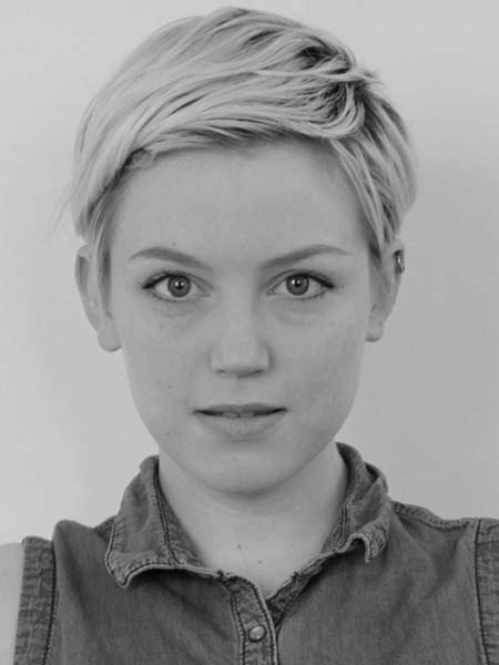 a black and white photo of a woman with short hair