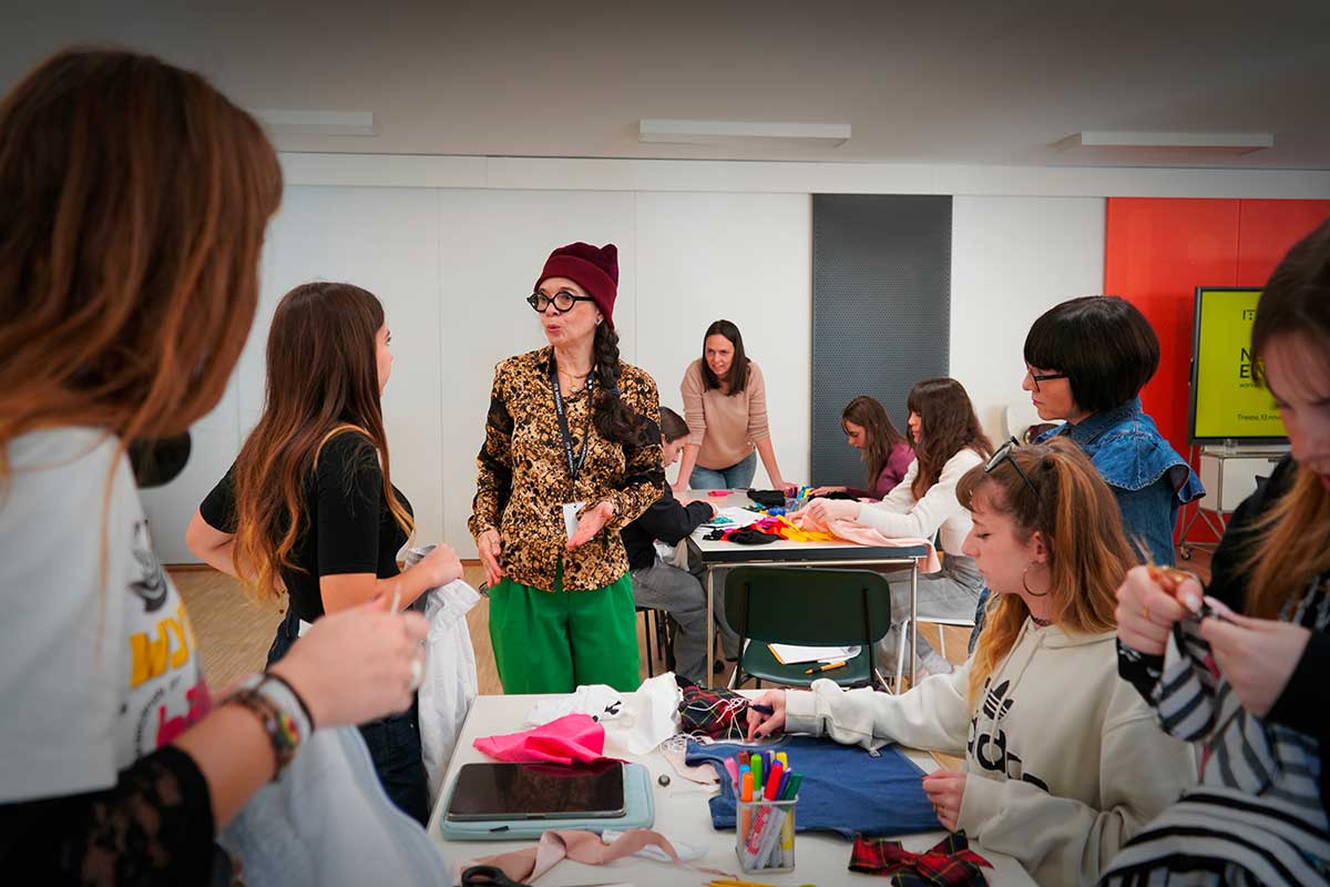 a group of young women standing around a table